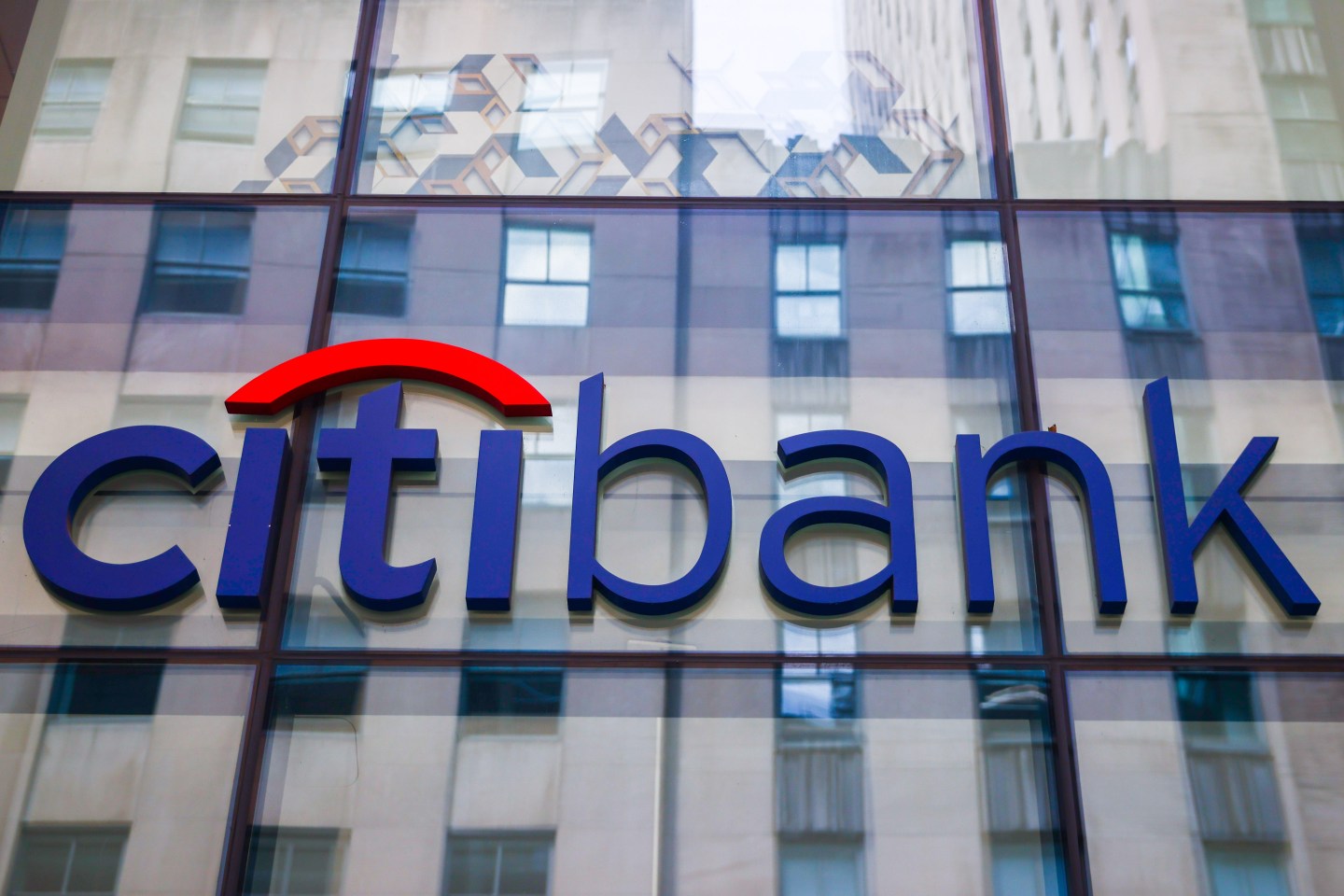 Citi Bank headquarters with digital blockchain graphics overlay, representing digital banking innovation in 2024